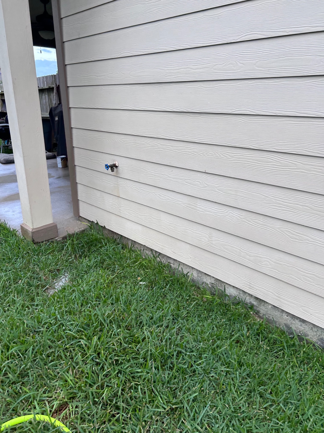 Restored house siding free of algae and mildew after soft washing in Cypress, TX